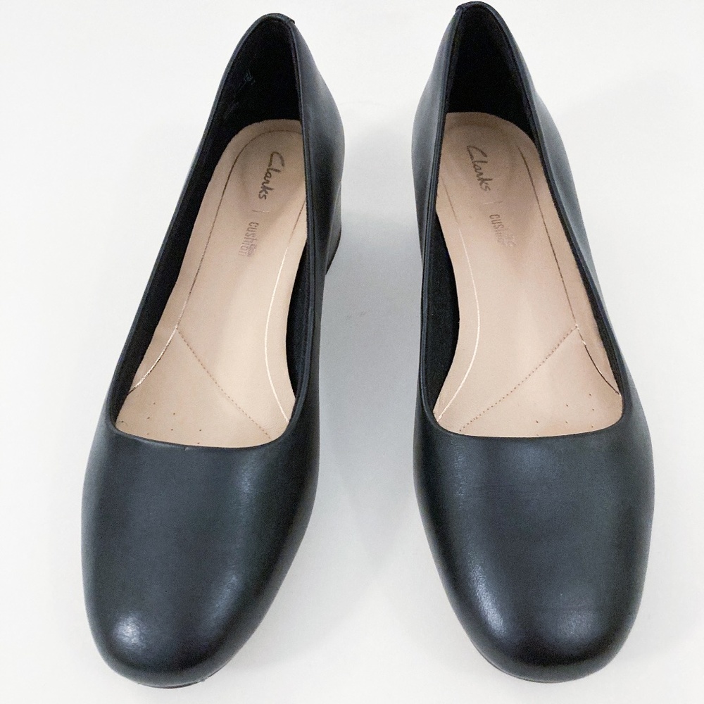 Clarks Ballerinas with a tiny heel (very comfortable with padding inside)